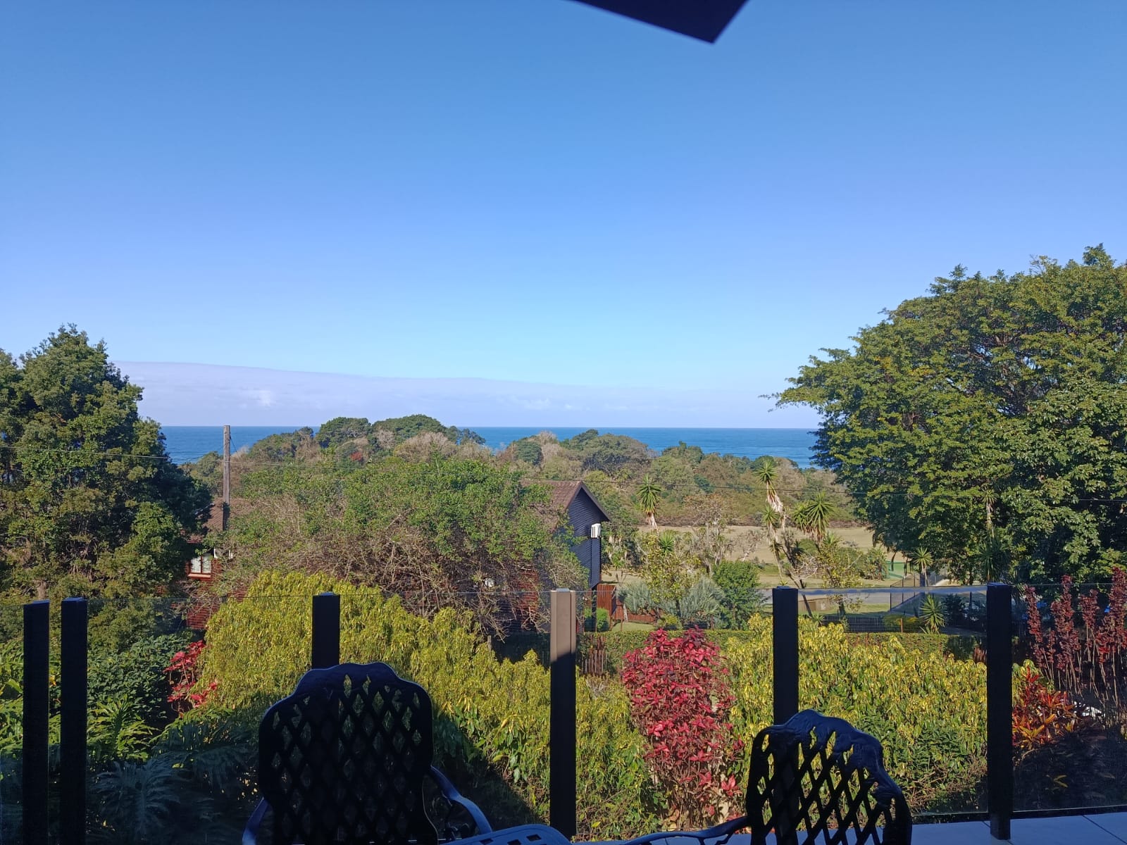 The Indian Ocean seen over the treetops from The Tee Box