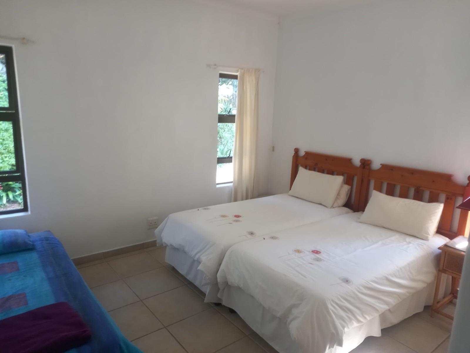 The second bedroom, set up with twin beds